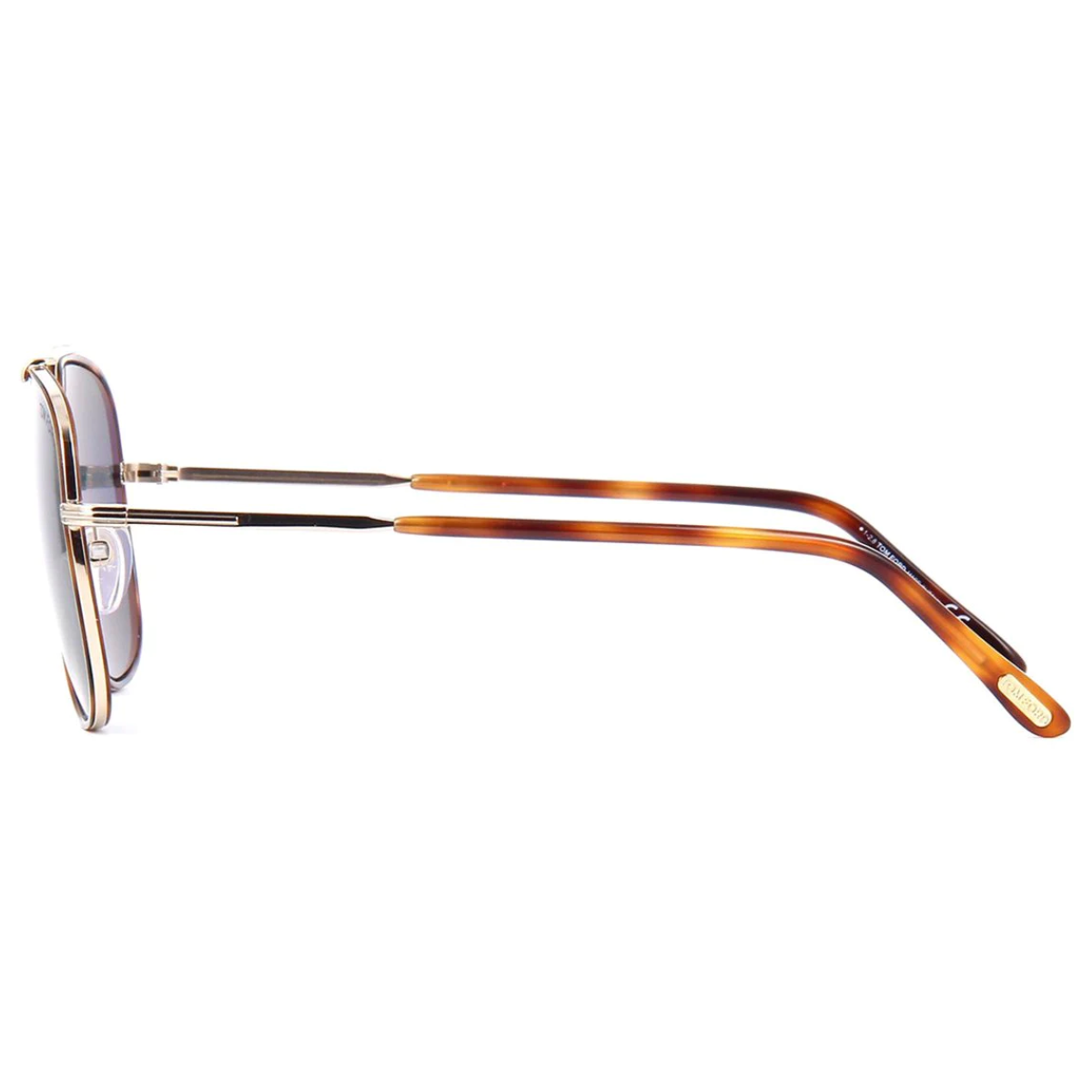 "A stylish individual wearing Tom Ford 693 aviator sunglasses, showcasing the non-polarized light green lenses and metal frames with gold and Havana accents, perfect for elevating any look."