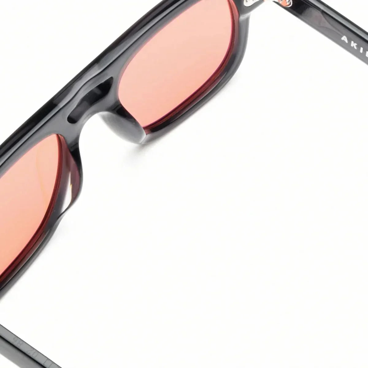 Akila Sunglass Dillinger Onyx Apricot designer sunglasses in bold Onyx frame with Apricot lenses, premium sunglasses with UV protection for mens sunglasses and womens sunglasses, luxury fashion sunglasses online optorium.
