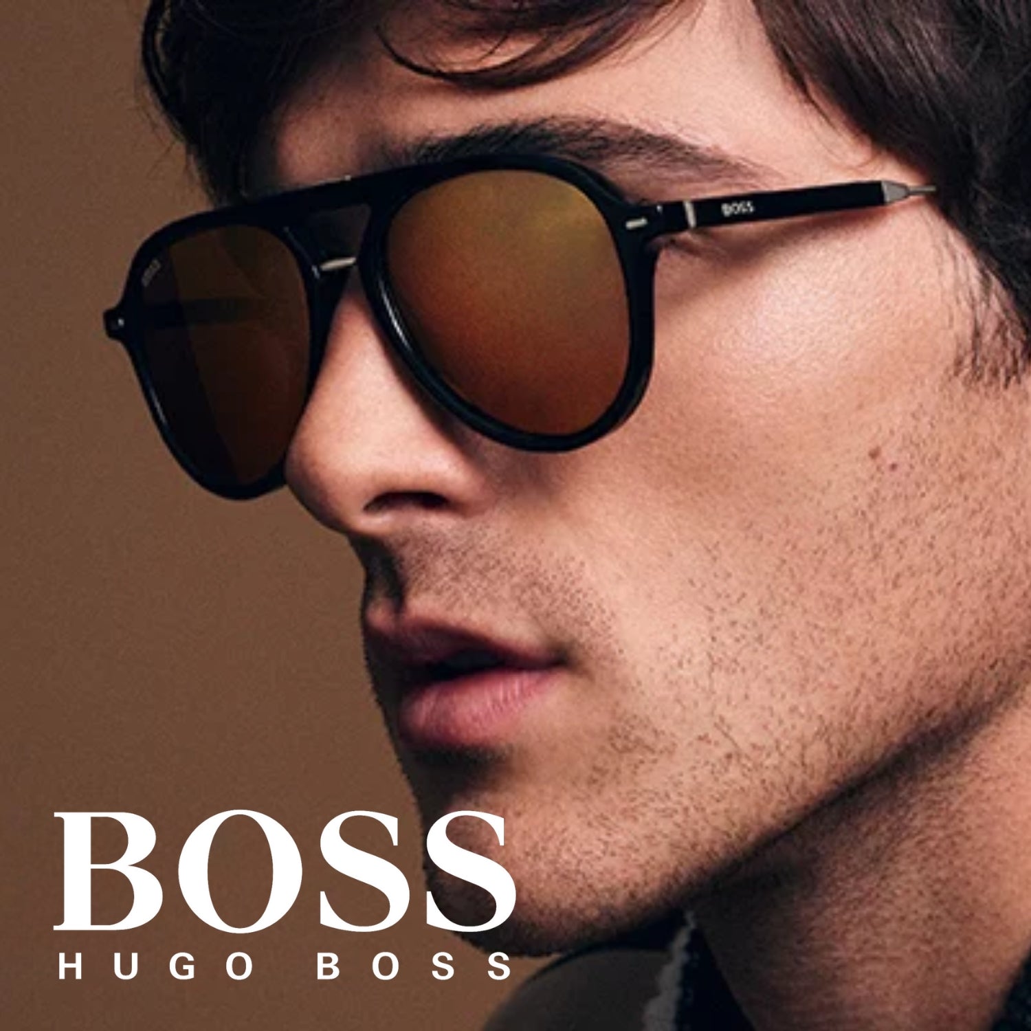 "Stylish man & women donning Boss' sunglasses, epitomizing luxury eyewear at Optorium eye wears"