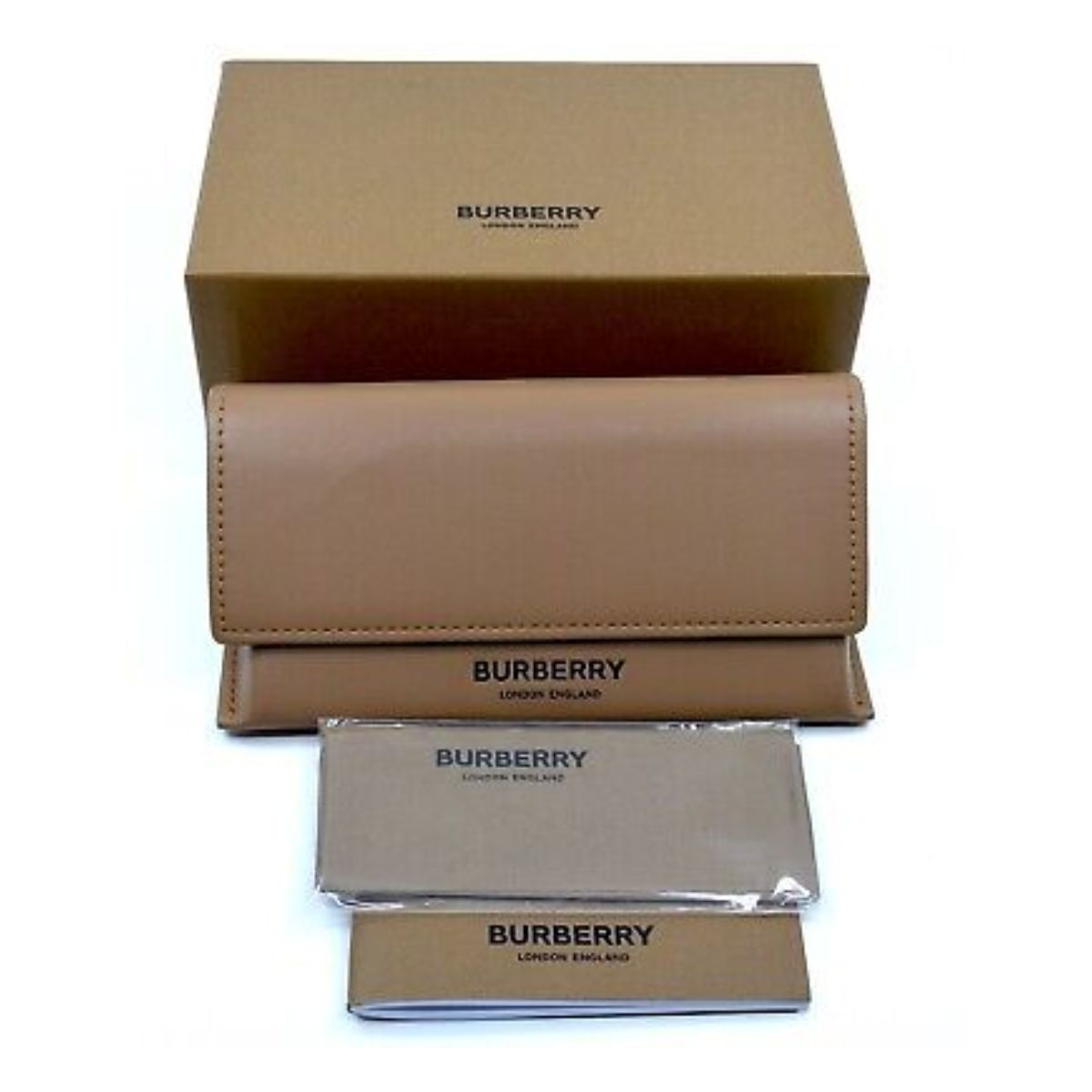 "Dynamic shot of a couple both wearing Burberry 4378-U black frame sunglasses with red lenses, showcasing their versatility and style statement for all genders."