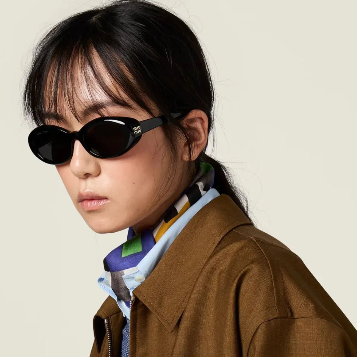 Stylish Miu Miu black colour sunglasses for women SMU B09 16K-08Z at Optorium