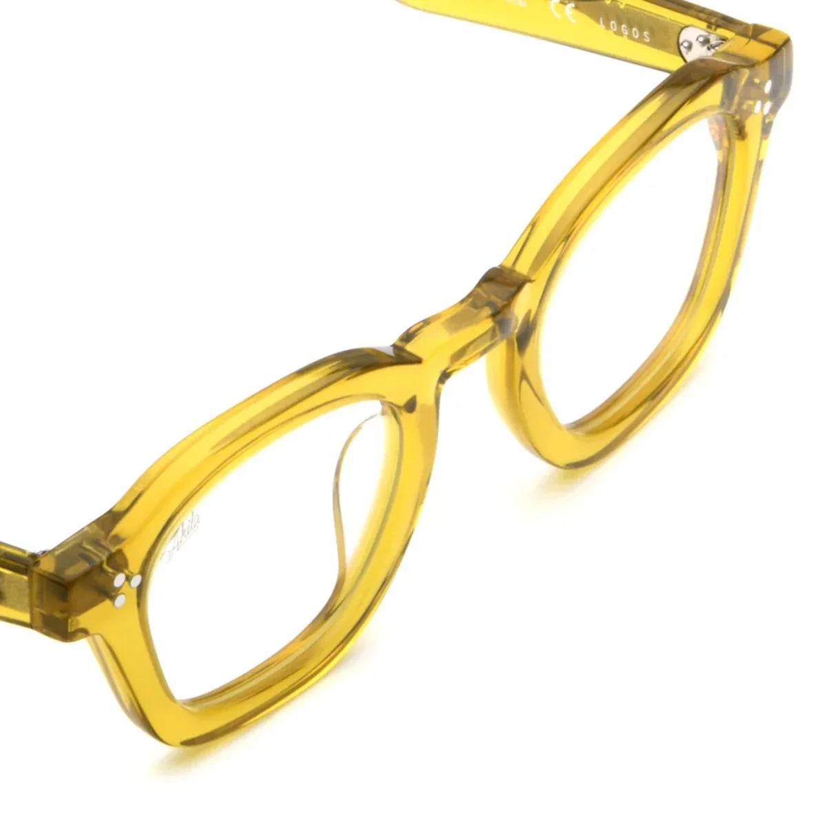 Shop Akila glasses featuring the transparent yellow Akila Logos frame, a designer Akila optical frame with square shape, premium acetate build, unisex styling and trending Akila luxury eyeglasses collection available at optorium