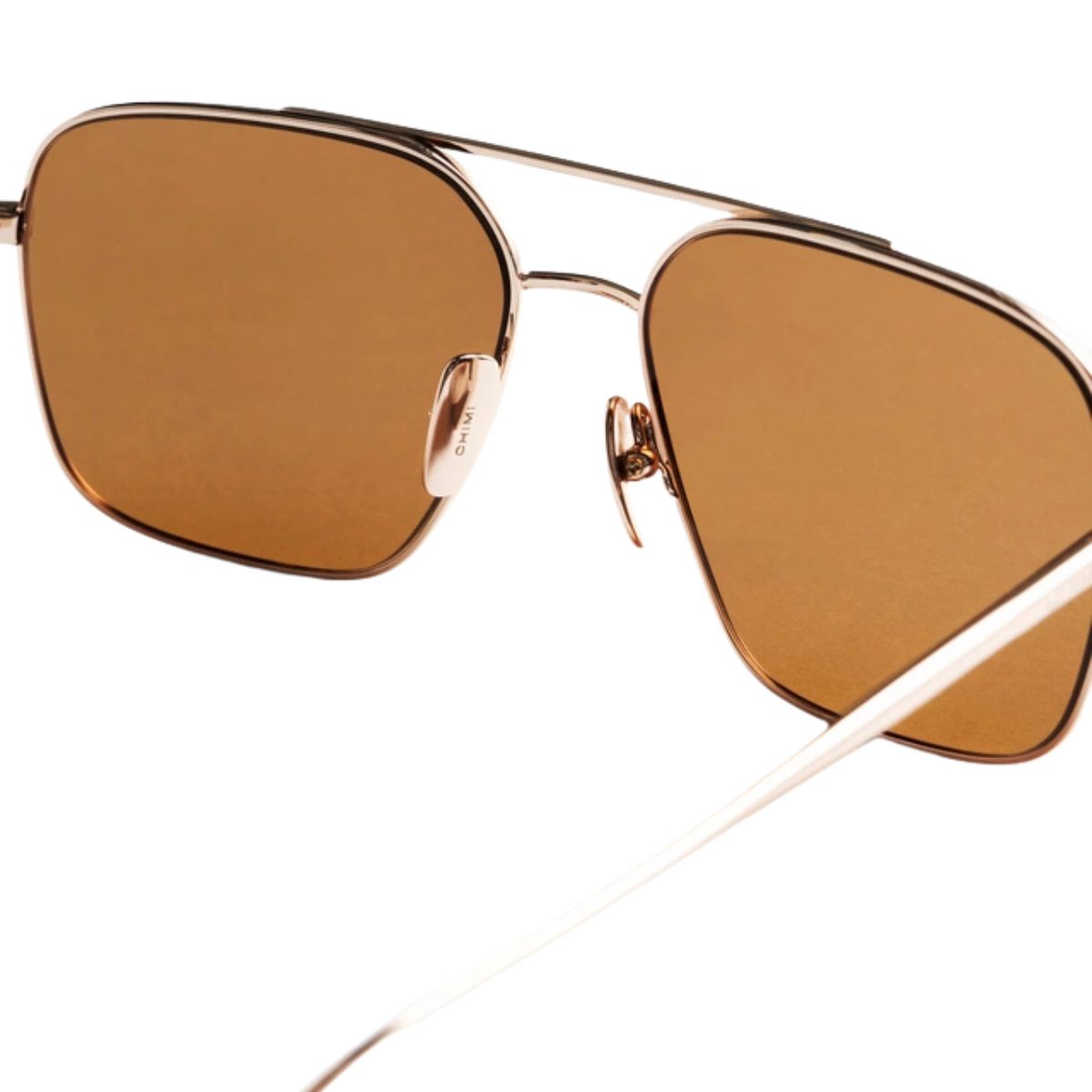 "Chimi brown aviator sunglasses offer modern comfort and UV safety, available at Optorium."